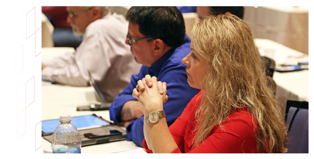 man and woman watching an ADA lecture